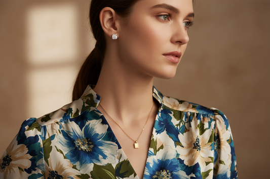 Woman wearing a floral print blouse with minimalist diamond jewelry, showcasing how to style jewelry with prints and patterns gracefully.