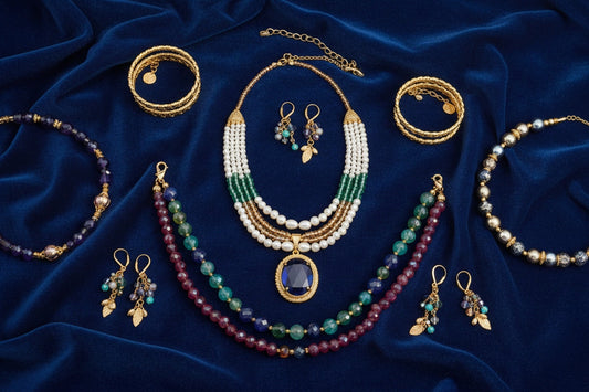 A premium editorial shot of luxury beaded jewelry arranged on rich velvet.